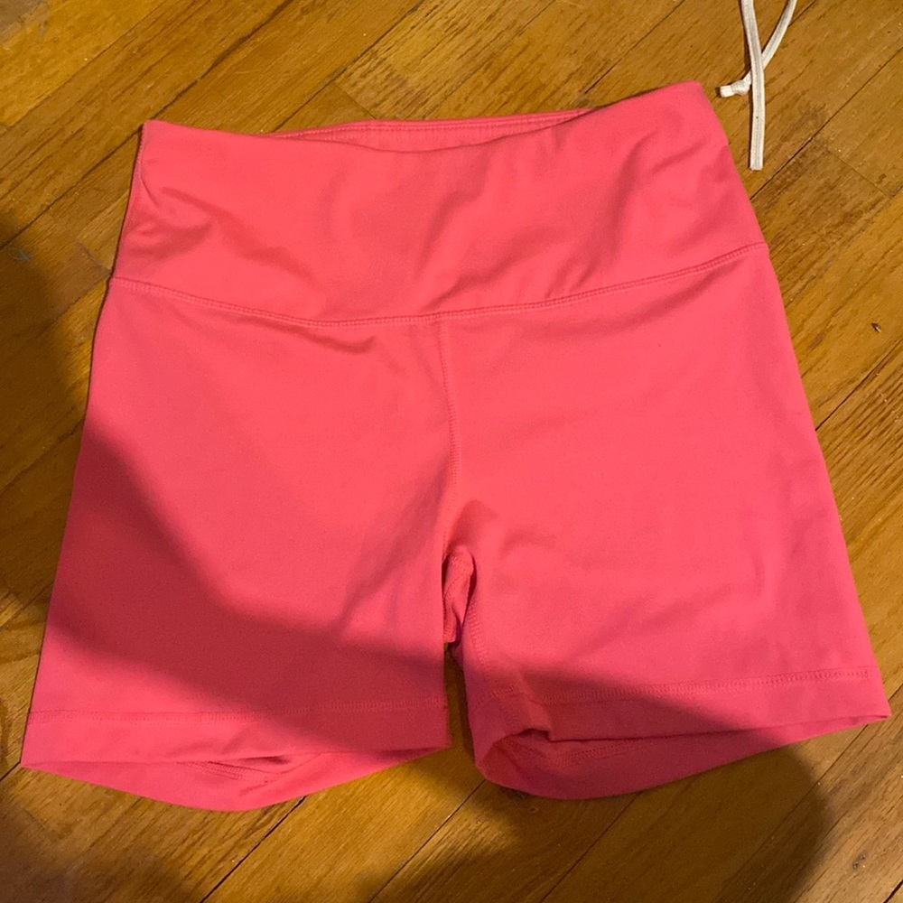 bright pink biker shorts with pocket